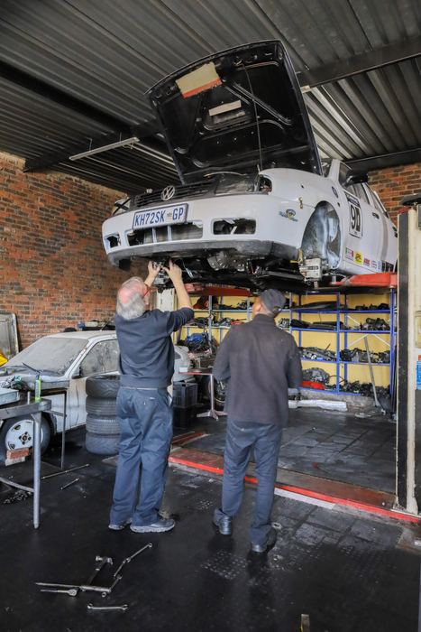 The race car on the lift during the build