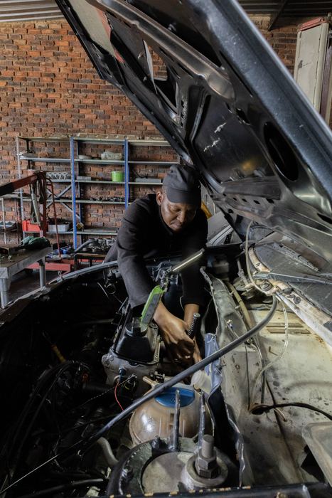 Working under a car in the workshop